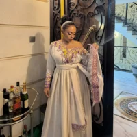ግርማ ሞገስ ያለው ቀይ የሀበሻ ባህላዊ ቀሚስ - በፊደል ማርካቶ Ethiopian Traditional Dress –