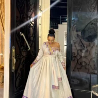 ግርማ ሞገስ ያለው ቀይ የሀበሻ ባህላዊ ቀሚስ - በፊደል ማርካቶ Ethiopian Traditional Dress –